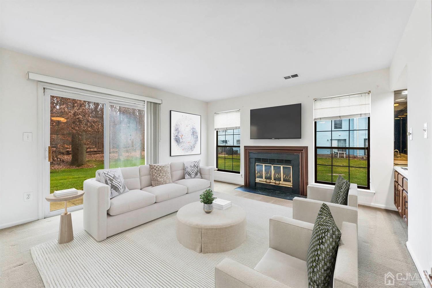 3708 Cricket Circle Edison, NJ 08820 - Photo 15 of 40 a living room with furniture a fireplace and a large window