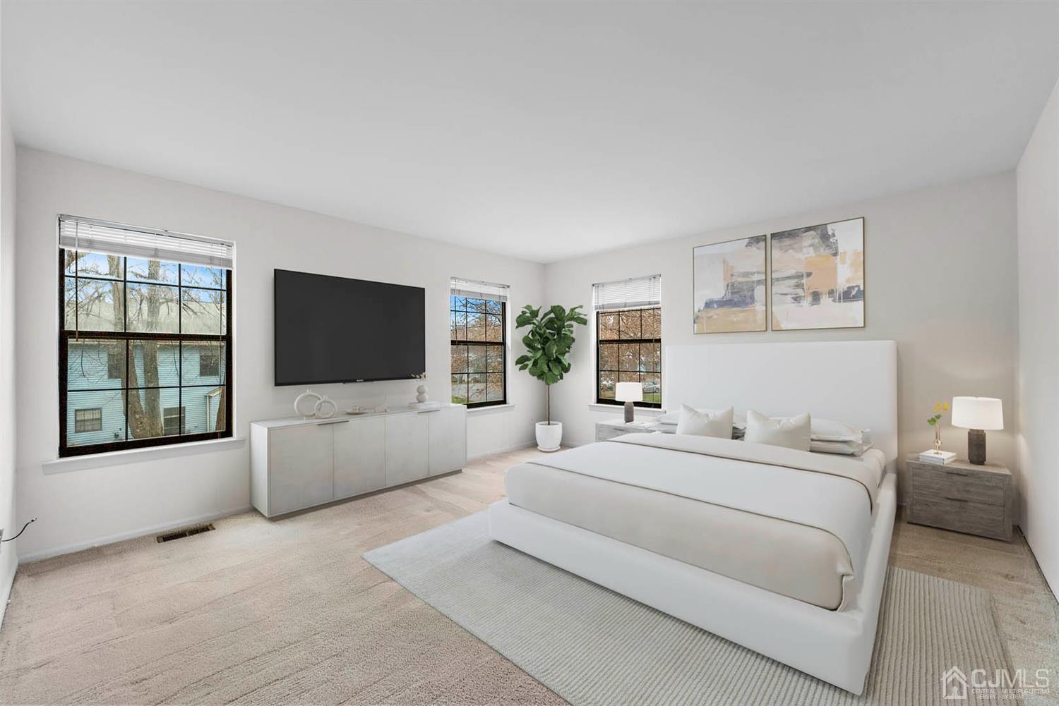 3708 Cricket Circle Edison, NJ 08820 - Photo 22 of 40 a bedroom with a large bed and a flat screen tv