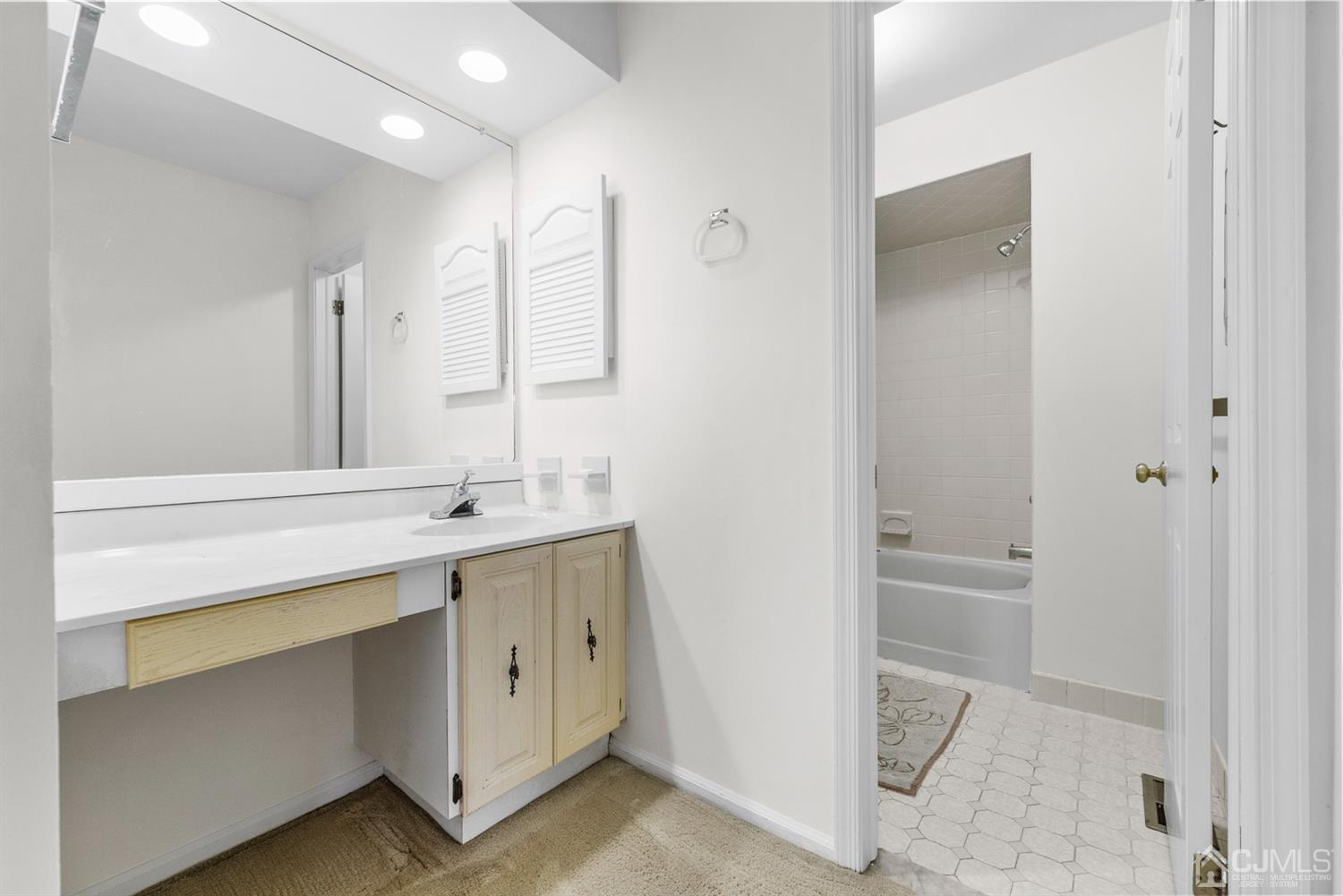 3708 Cricket Circle Edison, NJ 08820 - Photo 25 of 40 a spacious bathroom with a double vanity sink a mirror and a bathtub