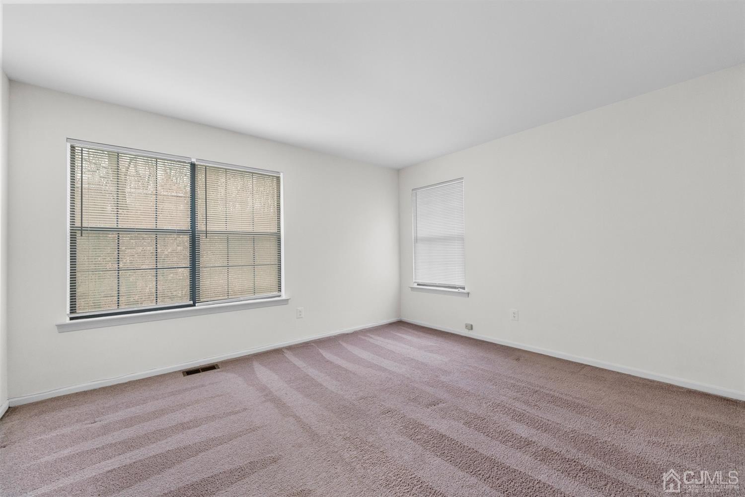 3708 Cricket Circle Edison, NJ 08820 - Photo 29 of 40 an empty room with wooden floor and windows