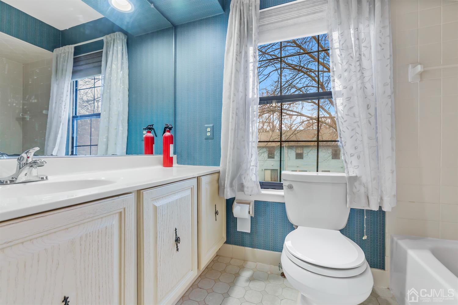 3708 Cricket Circle Edison, NJ 08820 - Photo 31 of 40 a bathroom with a toilet sink and mirror