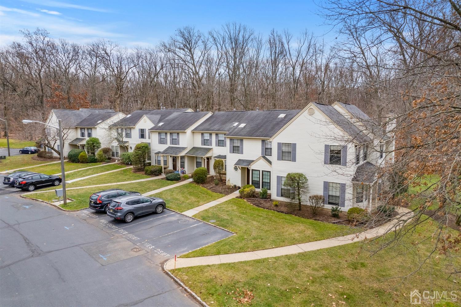 3708 Cricket Circle Edison, NJ 08820 - Photo 35 of 40 a view of a white house with a big yard and large trees
