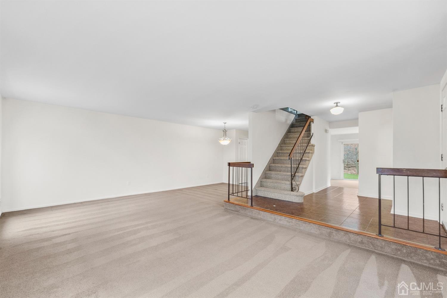 3708 Cricket Circle Edison, NJ 08820 - Photo 8 of 40 a view of an empty room with stairs