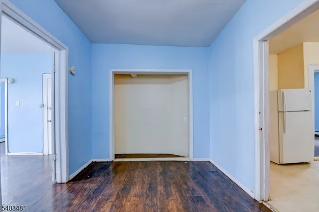 wooden floor in an empty room and a window