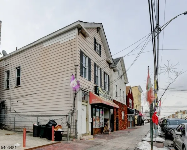 a view of a car parked in front of a buildings