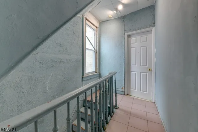 a view of a hallway with windows