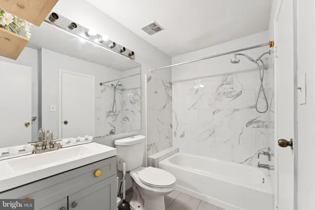 a bathroom with a sink a toilet and a bathtub