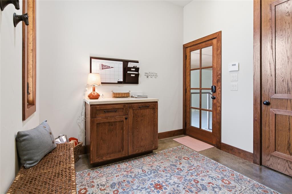 1138 Bancroft Road Keller, TX 76248 - Photo 28 of 39 Entryway featuring wood-finish flooring, a wood-paneled door with glass inserts, and a coordinating wood-paneled door