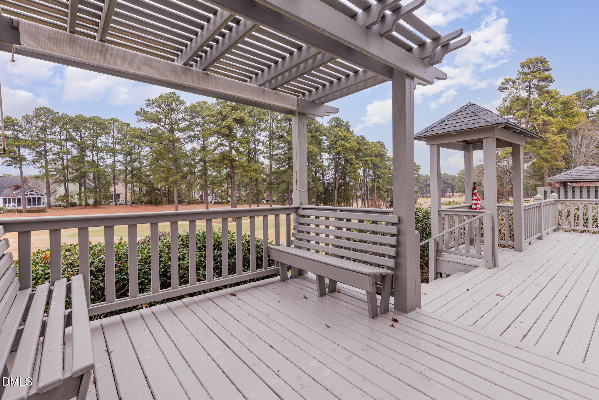 a view of a balcony with wooden floor