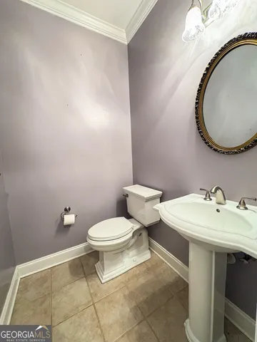 a bathroom with a tub a sink a mirror and a shower