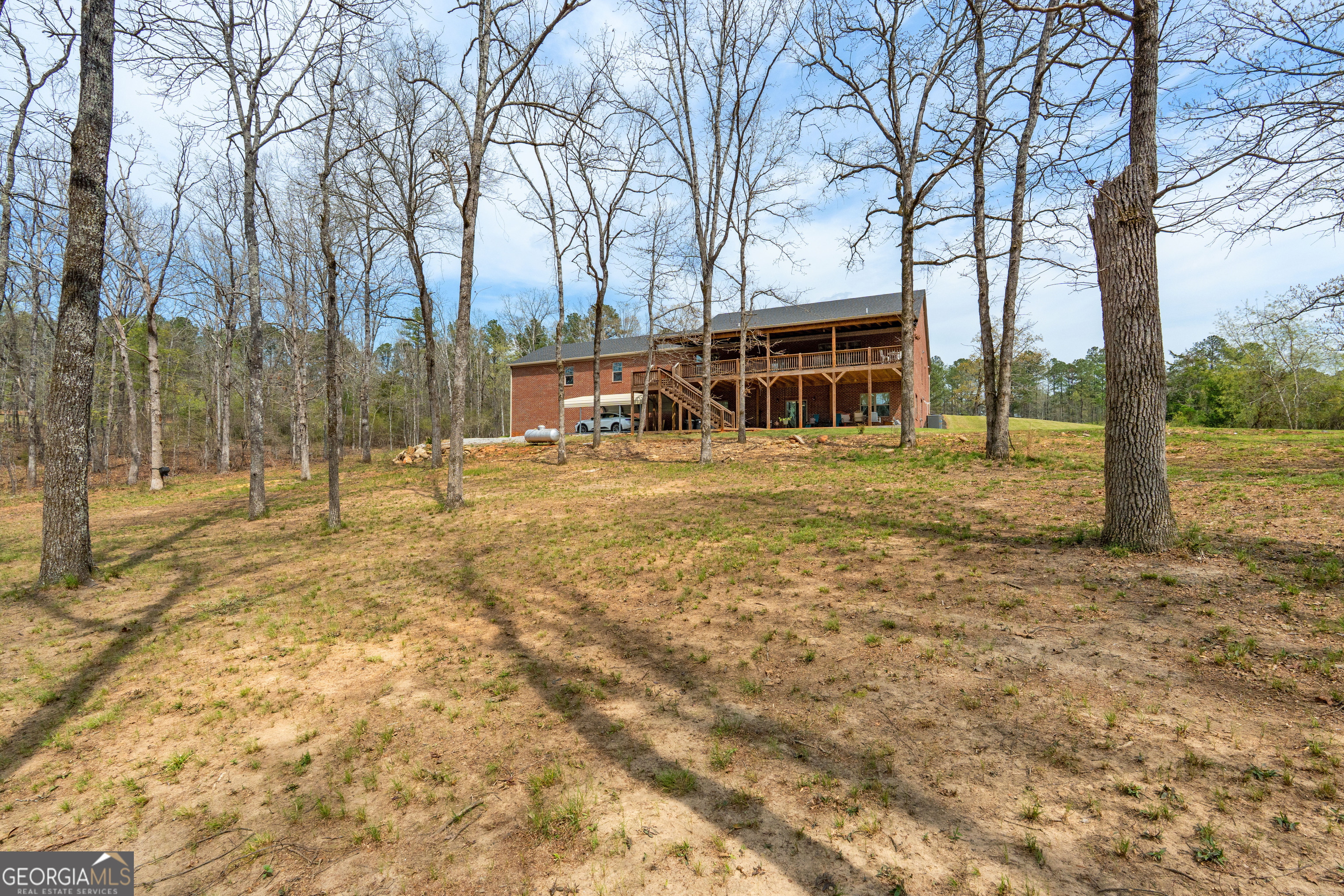 733 Cherry Road Franklin, GA 30217 - Photo 49 of 67 a view of a house with trees in the background