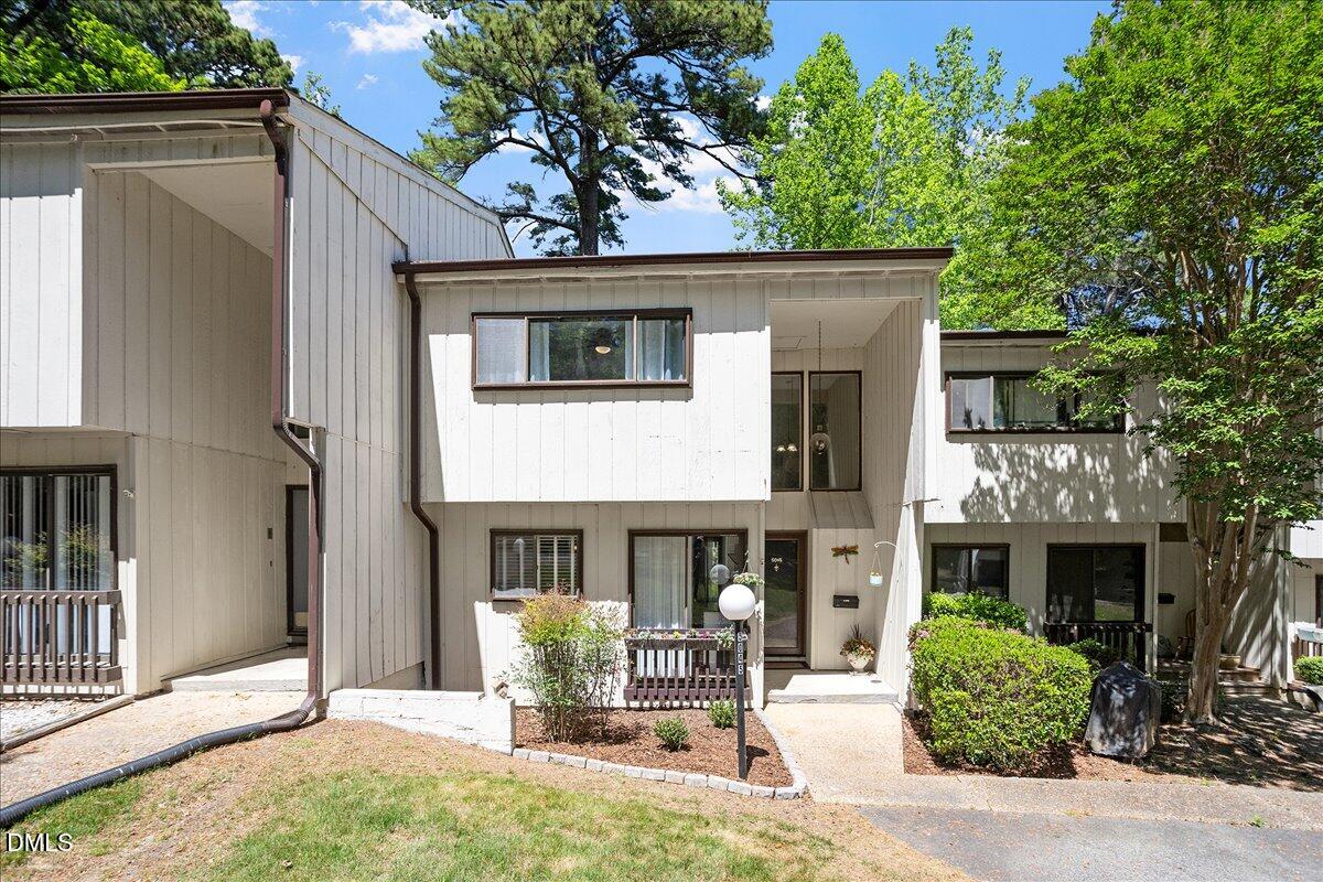 5045 Tall Pines Court Raleigh, NC 27609 - Photo 2 of 37 a front view of a house with yard and furniture