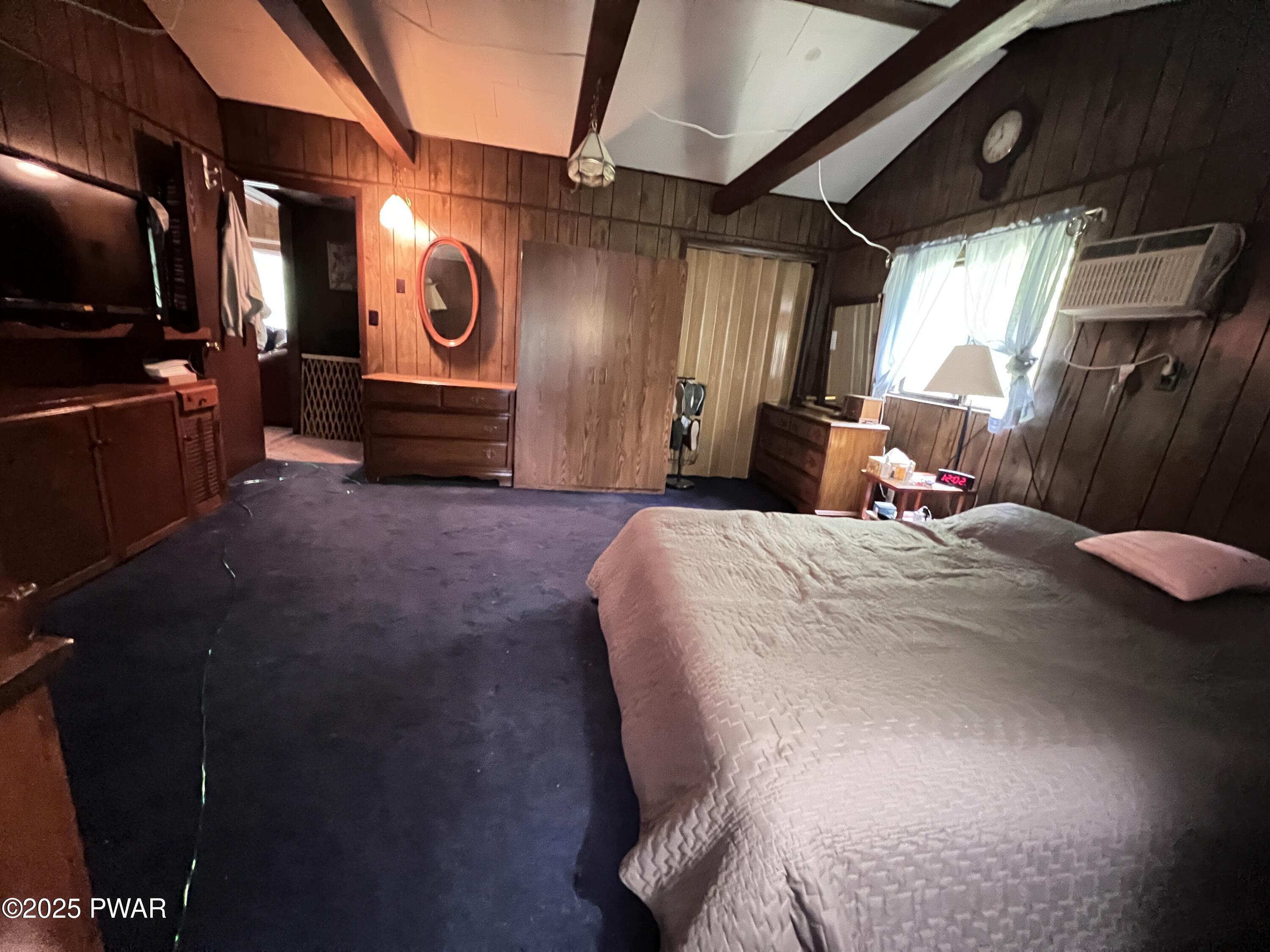 124 Roundhill Road Dingmans Ferry, PA 18328 - Photo 34 of 47 a bed room with a bed and a television