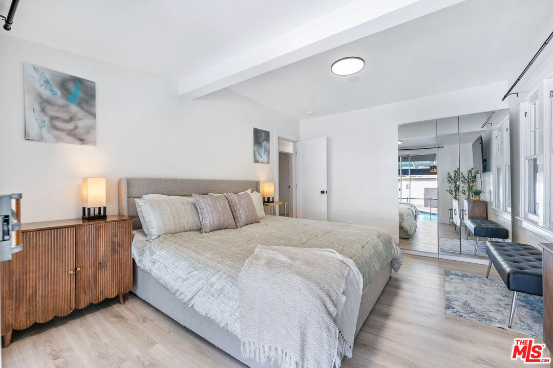 140 North Carson Road Beverly Hills, CA 90211 - Photo 14 of 28 a bed room with a bed and a couch