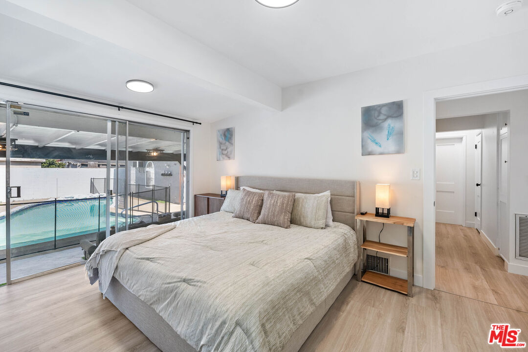 140 North Carson Road Beverly Hills, CA 90211 - Photo 16 of 28 a bedroom with a bed and a table