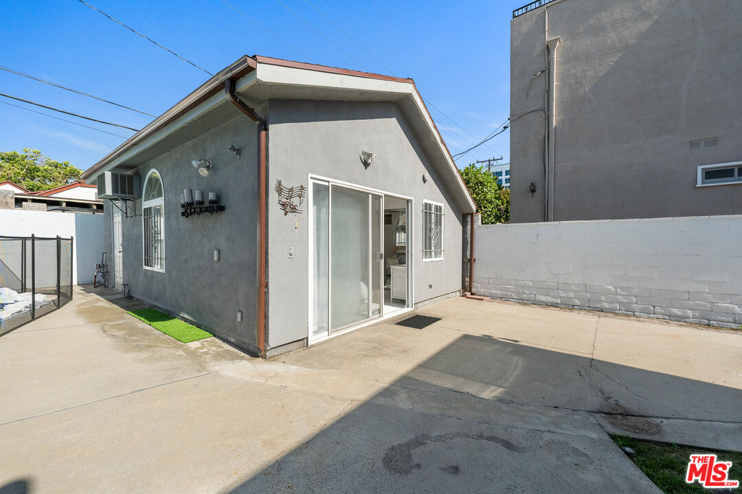 140 North Carson Road Beverly Hills, CA 90211 - Photo 19 of 28 a front view of a house with a porch
