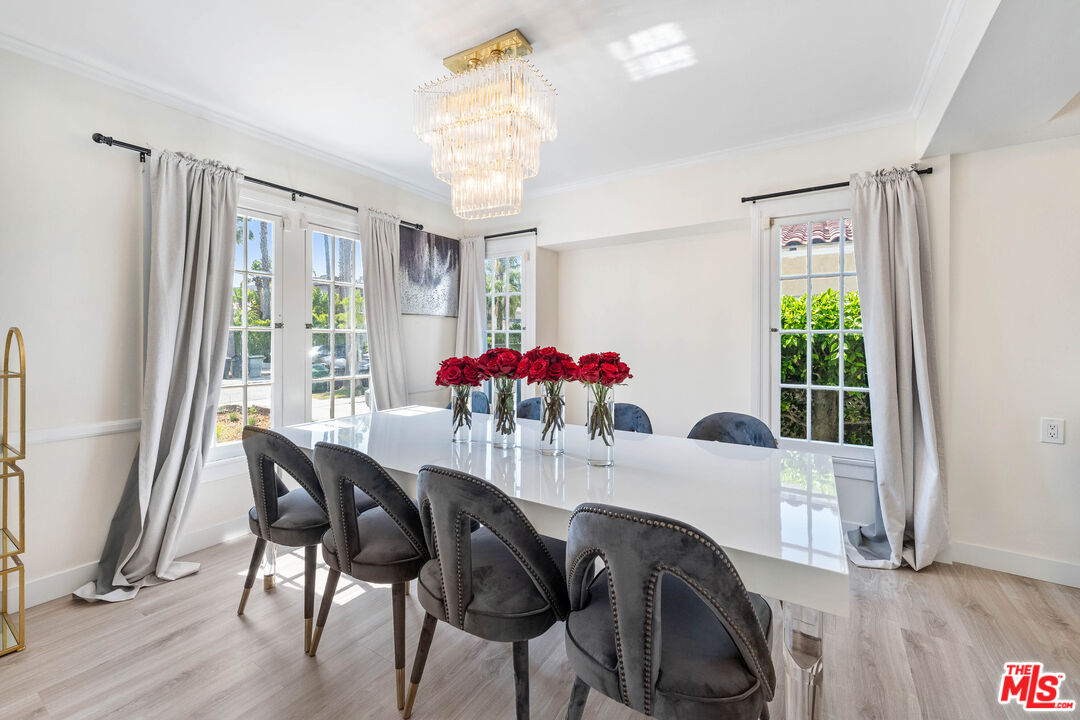 140 North Carson Road Beverly Hills, CA 90211 - Photo 3 of 28 a view of a dining room with furniture window and wooden floor