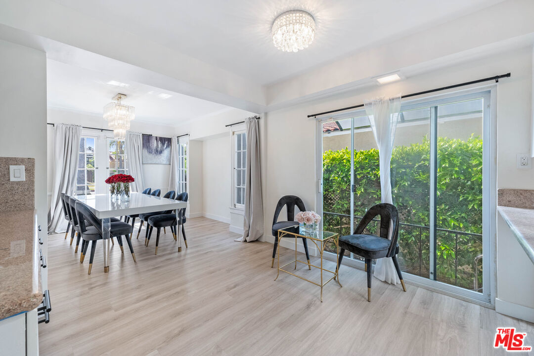140 North Carson Road Beverly Hills, CA 90211 - Photo 5 of 28 a living room with furniture and a large window
