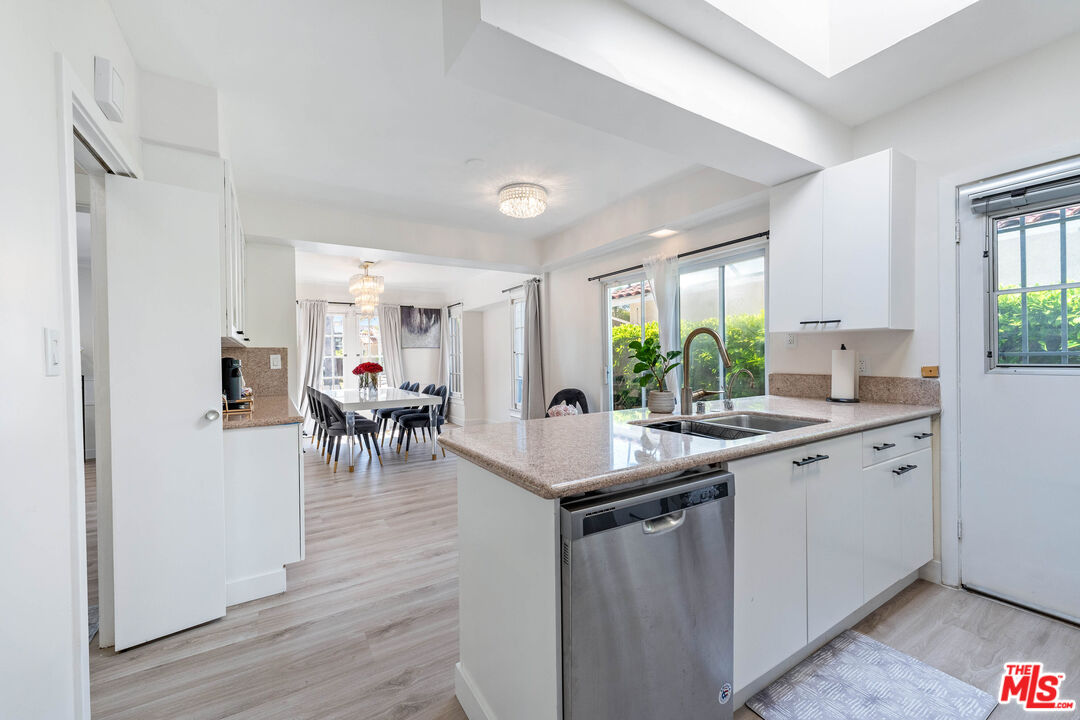 140 North Carson Road Beverly Hills, CA 90211 - Photo 7 of 28 a kitchen with a sink and cabinets