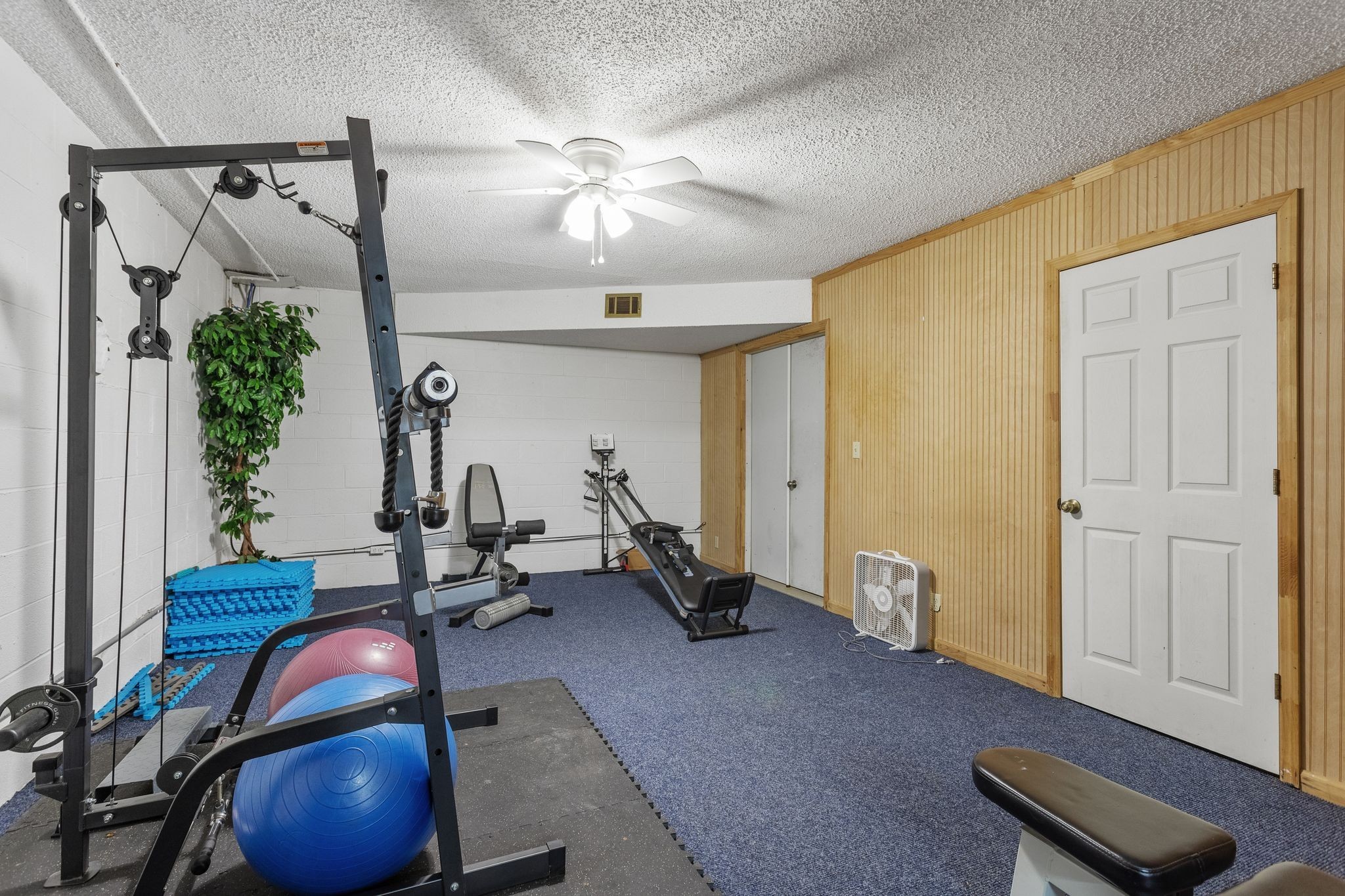 881 Mt Olivet Road Columbia, TN 38401 - Photo 44 of 68 a room with gym equipment and wooden floor
