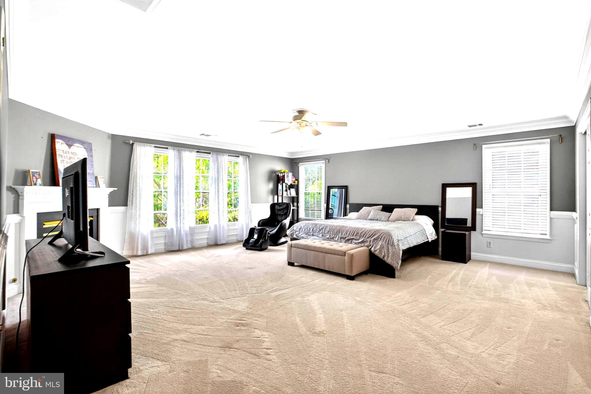 8084 Station Road Manassas, VA 20111 - Photo 22 of 55 AMAZING SPACIOUS Primary Bedroom with ceiling fan