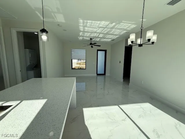 a view of a hallway with a chandelier