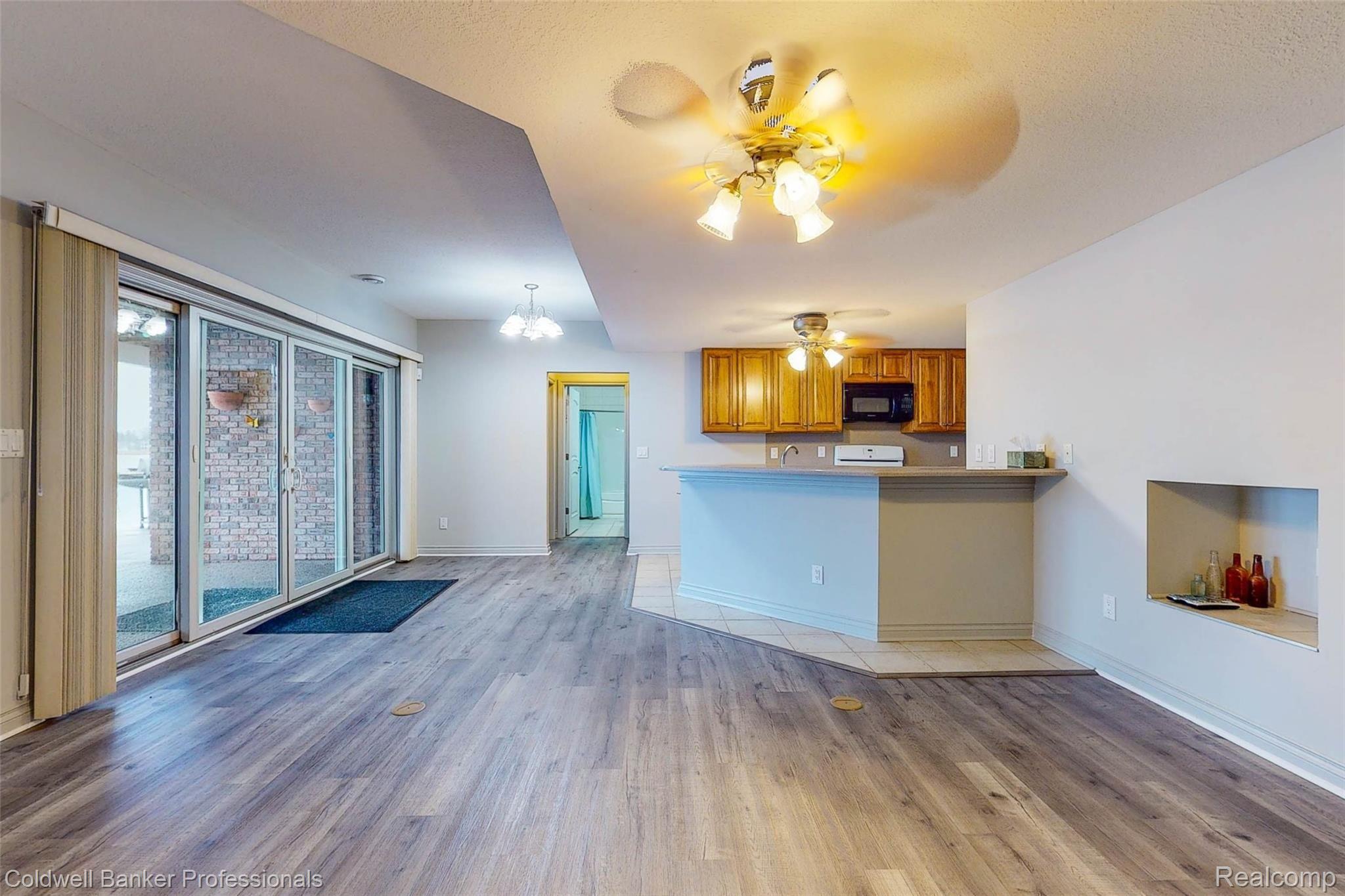 6576 Bennett Lake Road Fenton, MI 48430 - Photo 19 of 46 Lower Level Living room