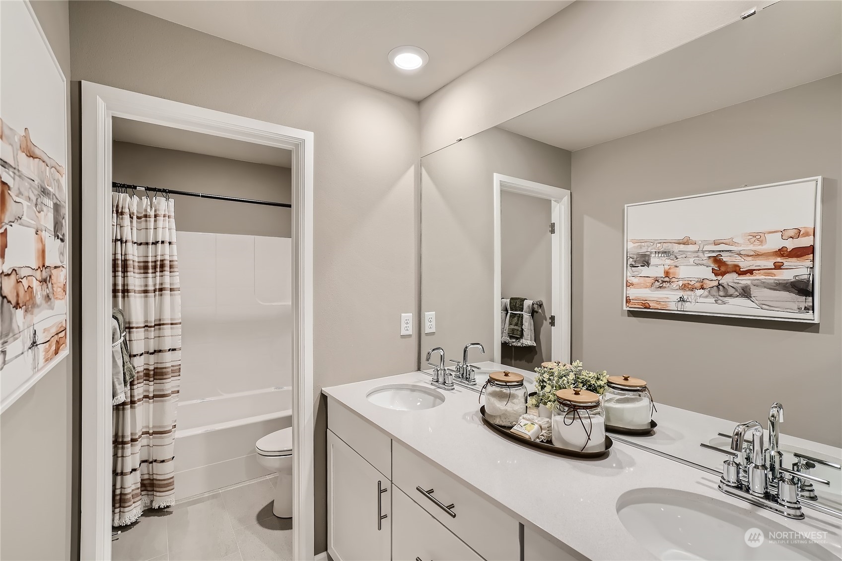 21029 42nd Avenue Southeast, Unit 116 Bothell, WA 98021 - Photo 22 of 22 a bathroom with a double vanity sink and mirror