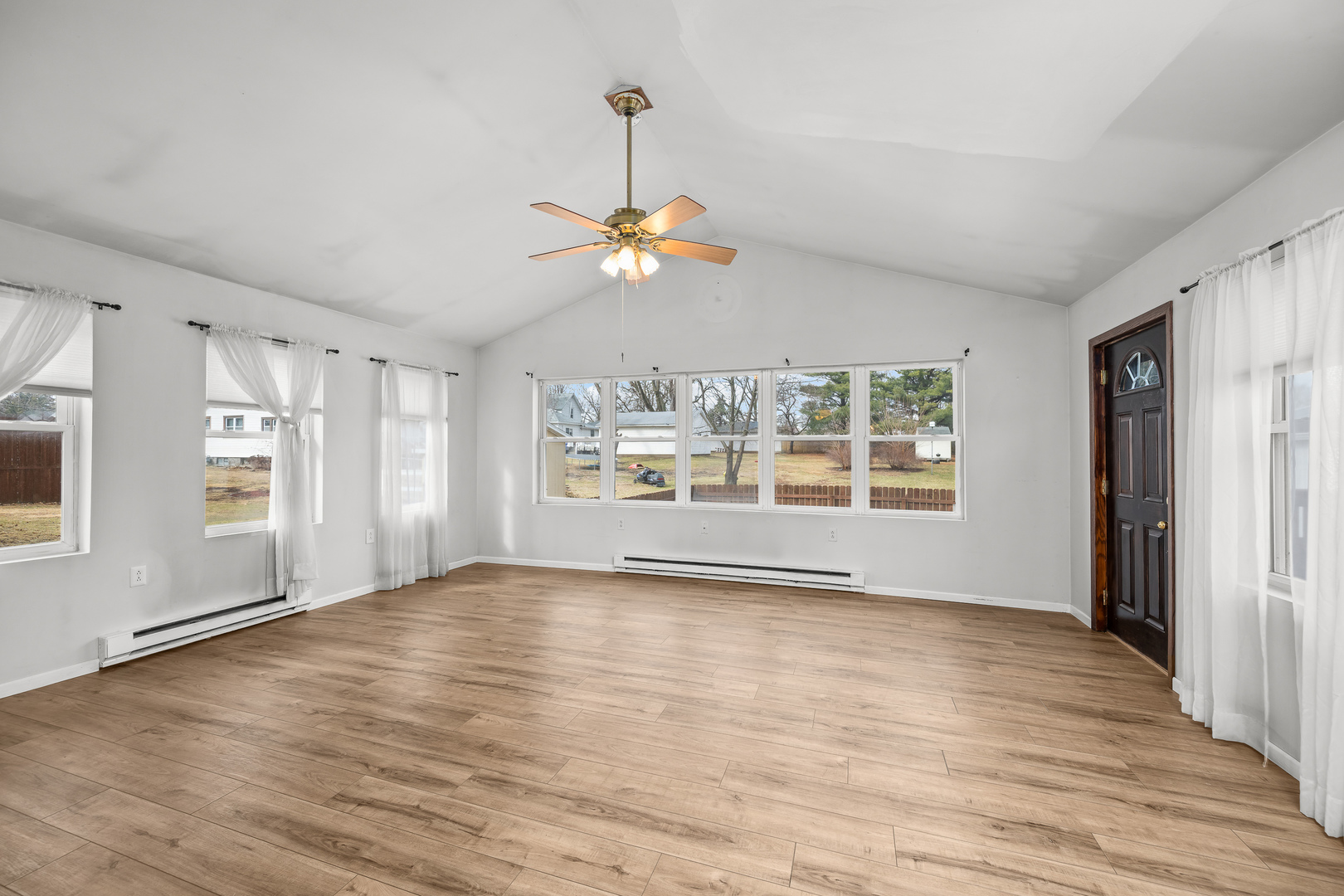 236 West Church Street Kewanee, IL 61443 - Photo 11 of 22 a view of an empty room with a window and wooden floor