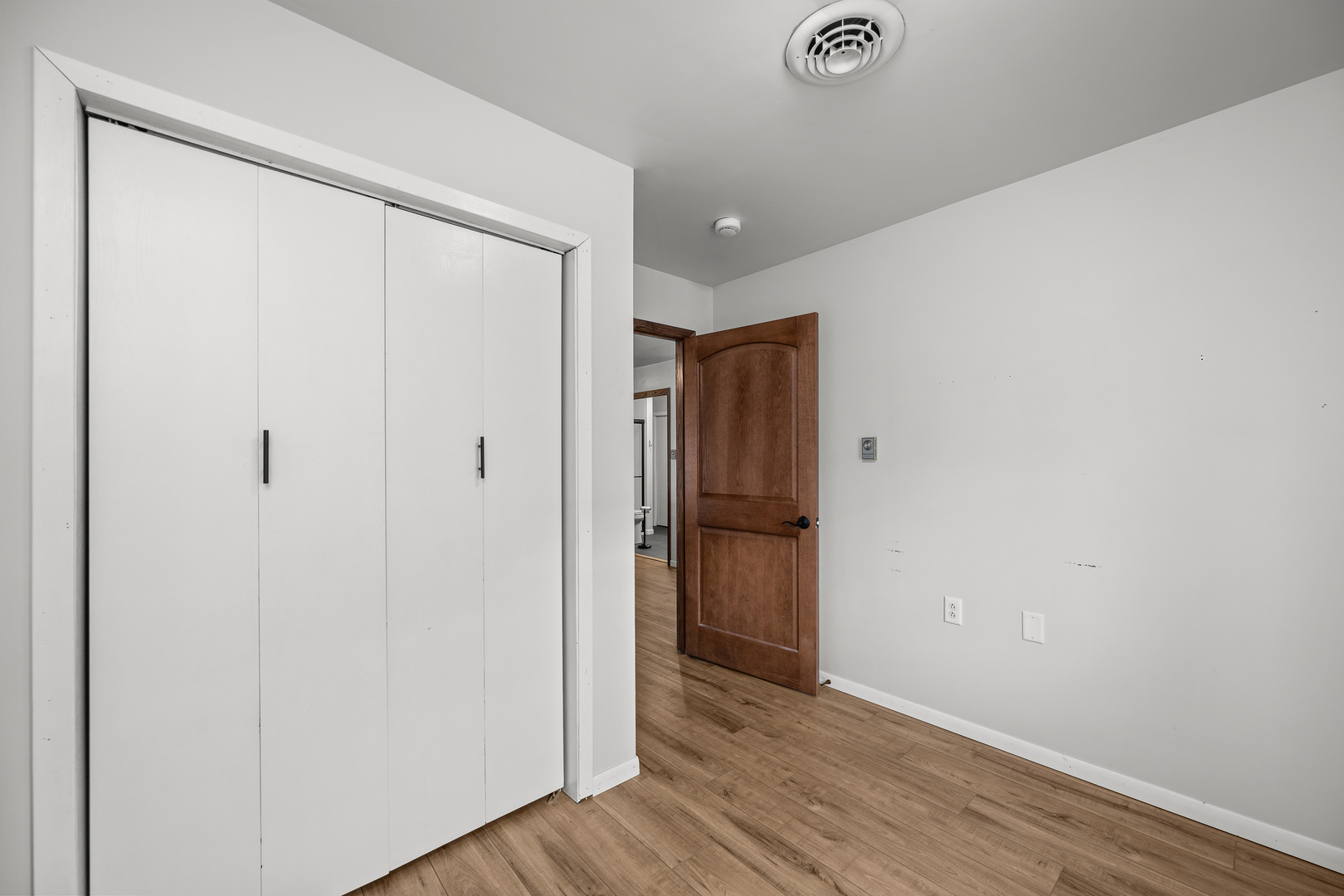 236 West Church Street Kewanee, IL 61443 - Photo 14 of 22 a view of an empty room with wooden floor