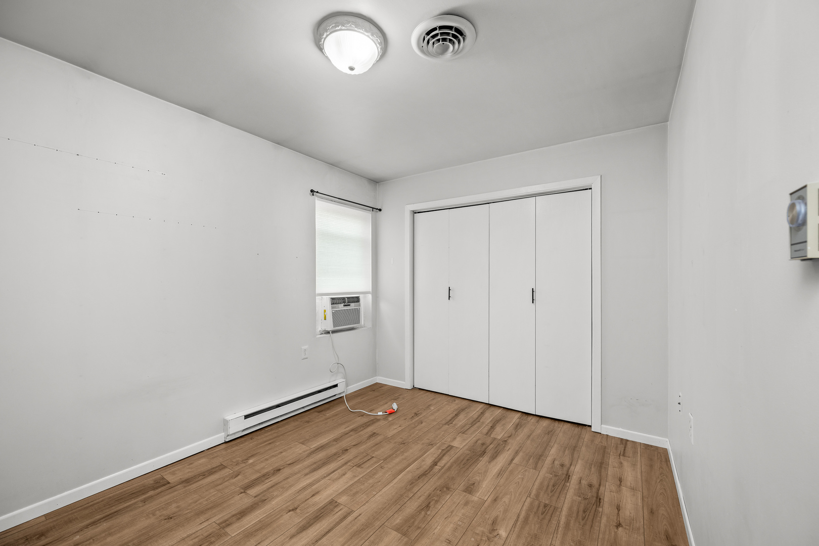 236 West Church Street Kewanee, IL 61443 - Photo 15 of 22 an empty room with wooden floor and windows