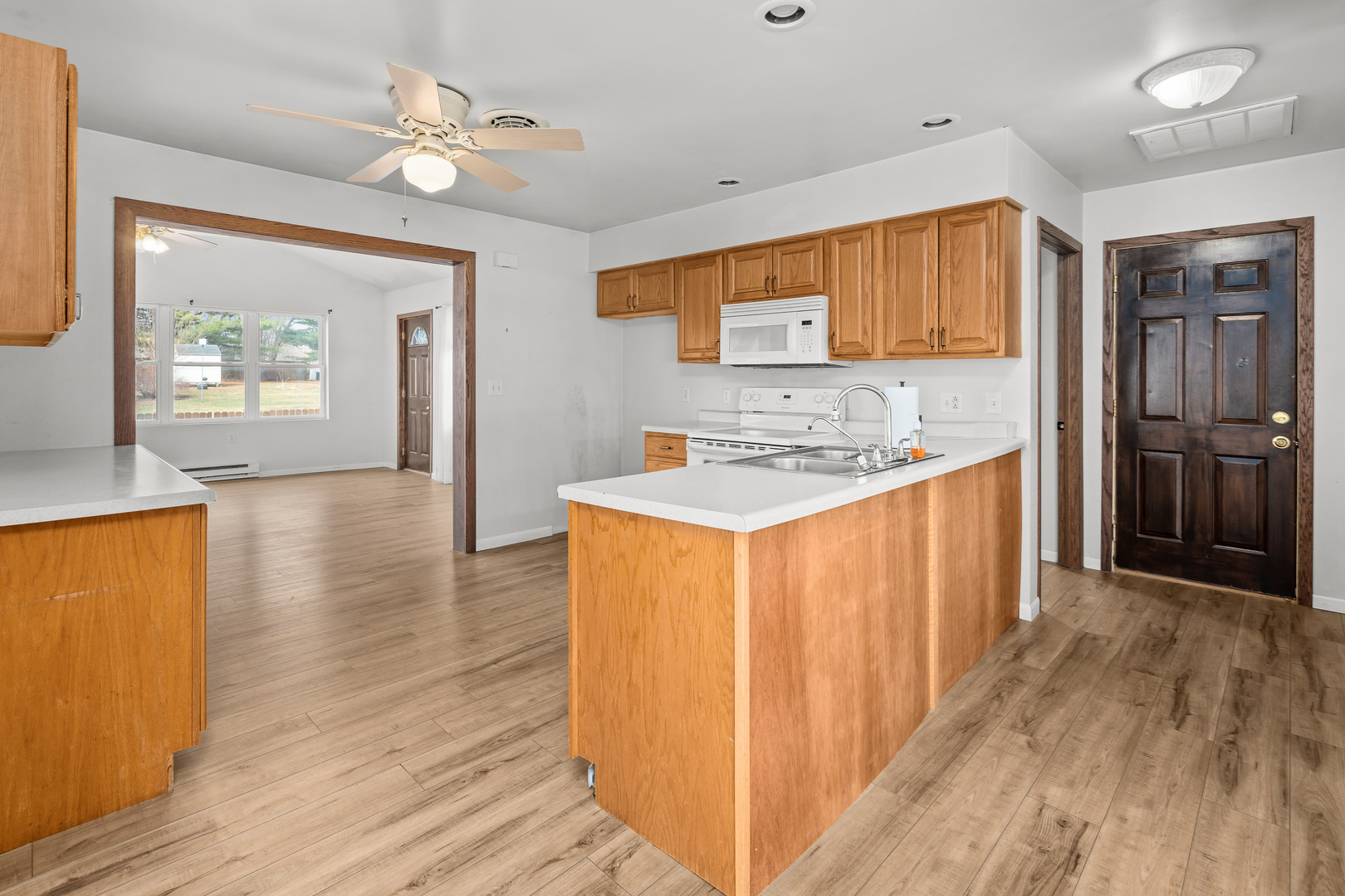 236 West Church Street Kewanee, IL 61443 - Photo 7 of 22 a kitchen with stainless steel appliances granite countertop a refrigerator a stove and a wooden floors