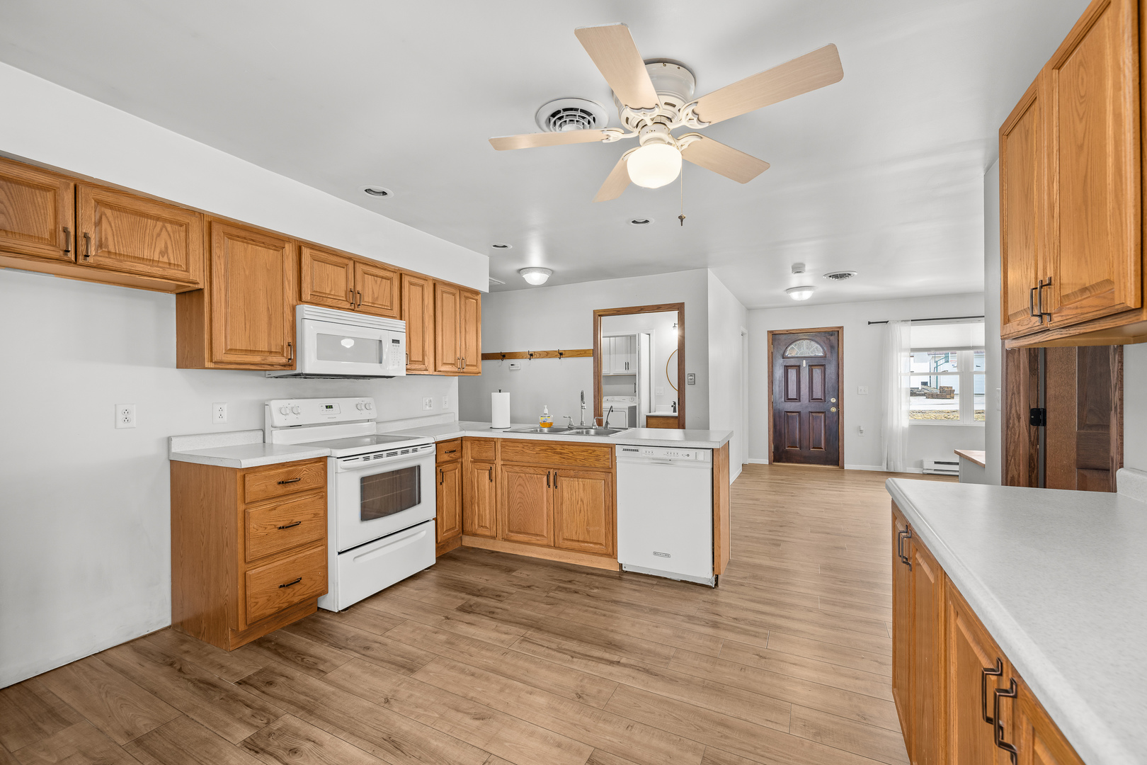 236 West Church Street Kewanee, IL 61443 - Photo 9 of 22 a large kitchen with stainless steel appliances granite countertop a stove top oven a sink a dining table and chairs with wooden floor