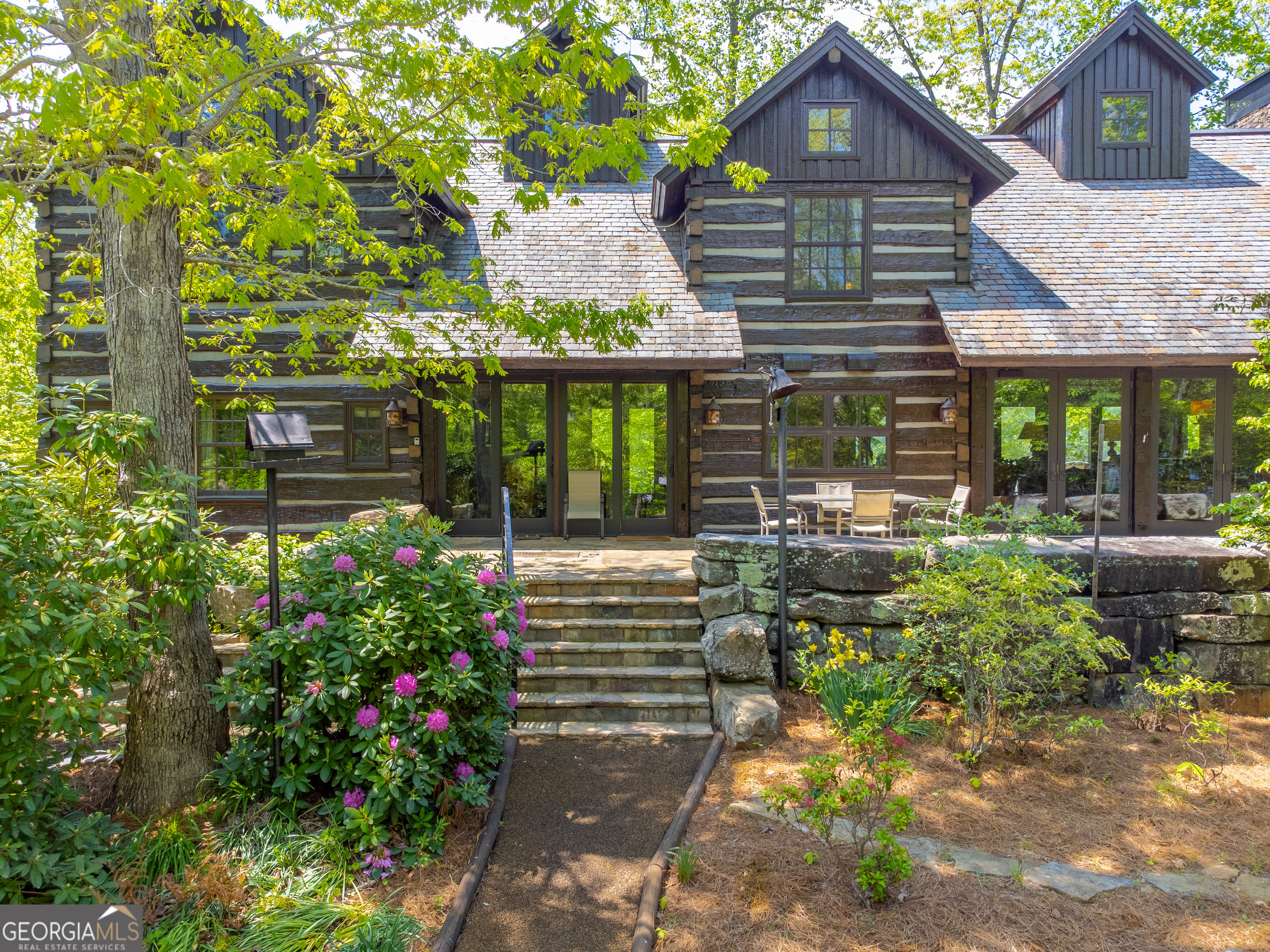 a front view of a house with garden