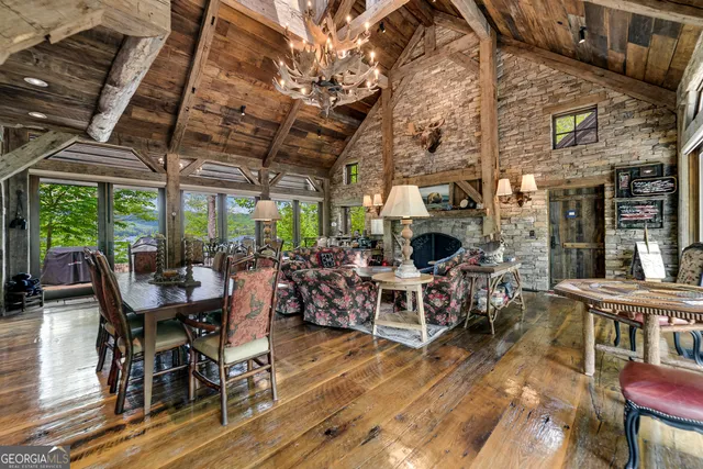 a bedroom with two beds and a large window