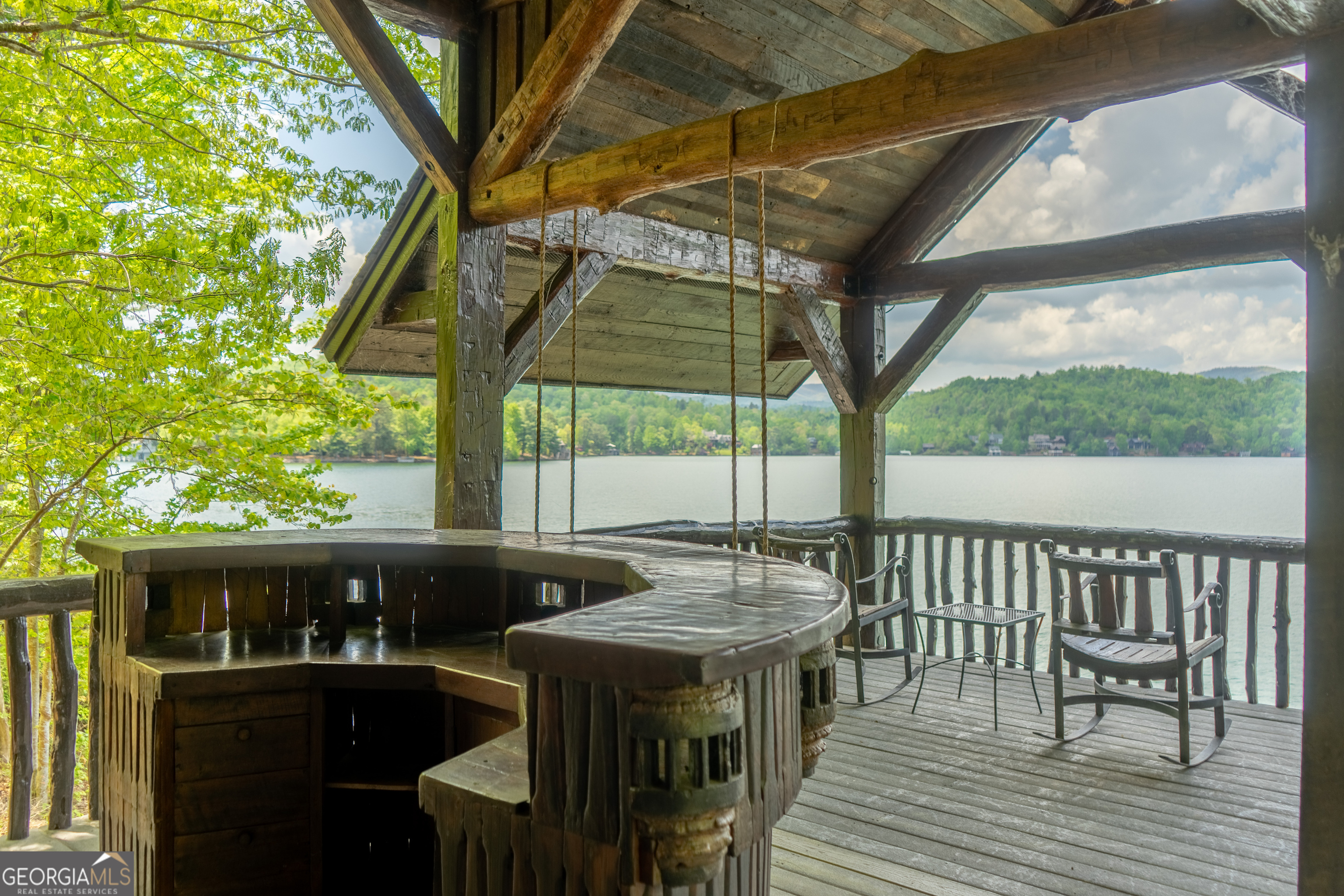 1 Burton Island Tiger, GA 30576 - Photo 75 of 98 a view of deck with table and chairs and wooden floor