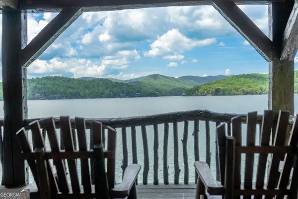 a living room with furniture a fireplace and a table