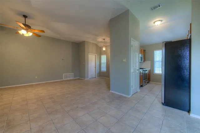 a kitchen with stainless steel appliances granite countertop a stove and a sink