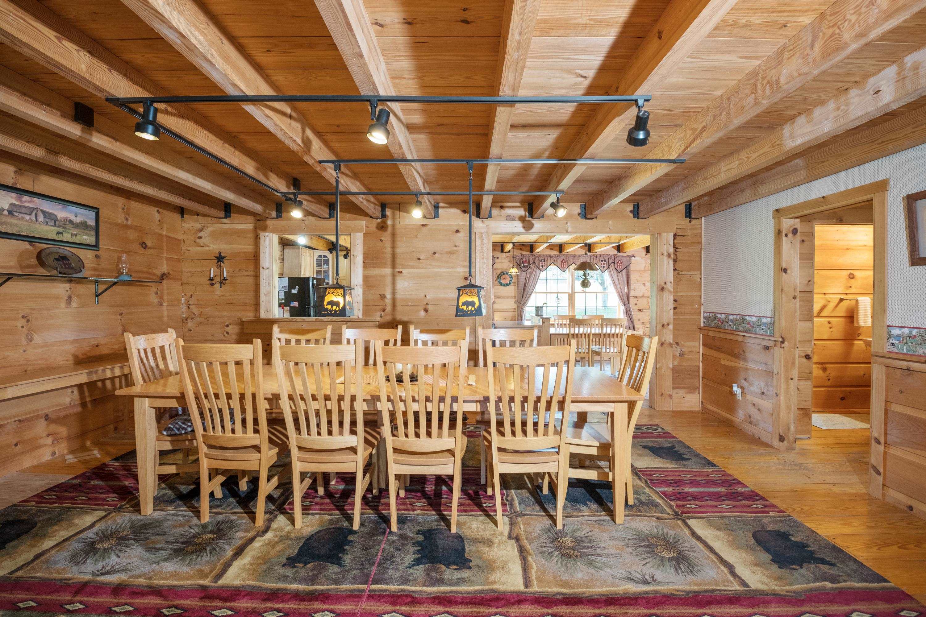 14238 Plains Mill Road Timberville, VA 22853 - Photo 16 of 68 a dining room with a wooden table and chairs