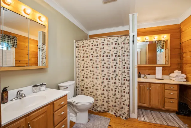 a bedroom with a large bed and a large window