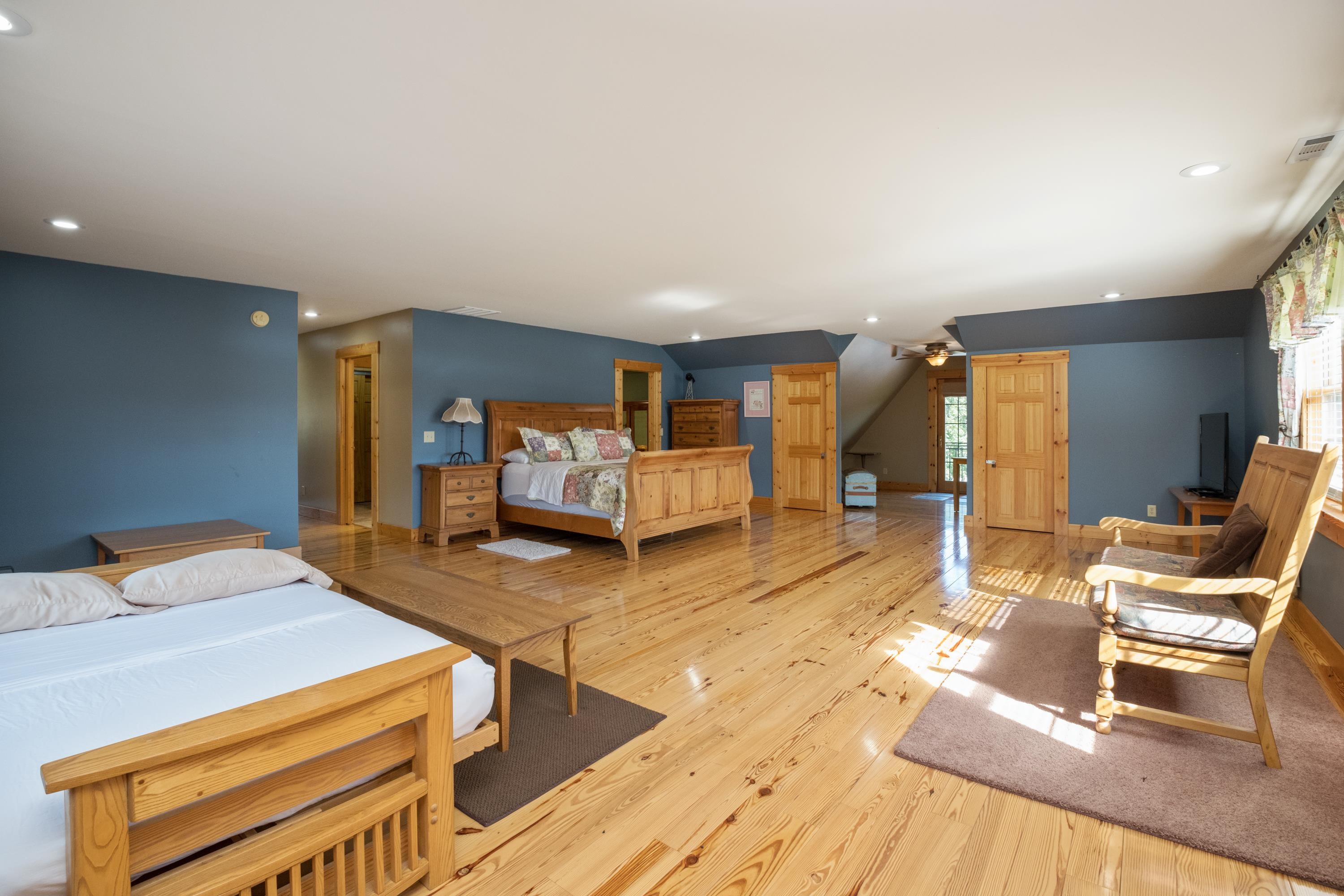 14238 Plains Mill Road Timberville, VA 22853 - Photo 32 of 68 a bedroom with furniture and a wooden floor