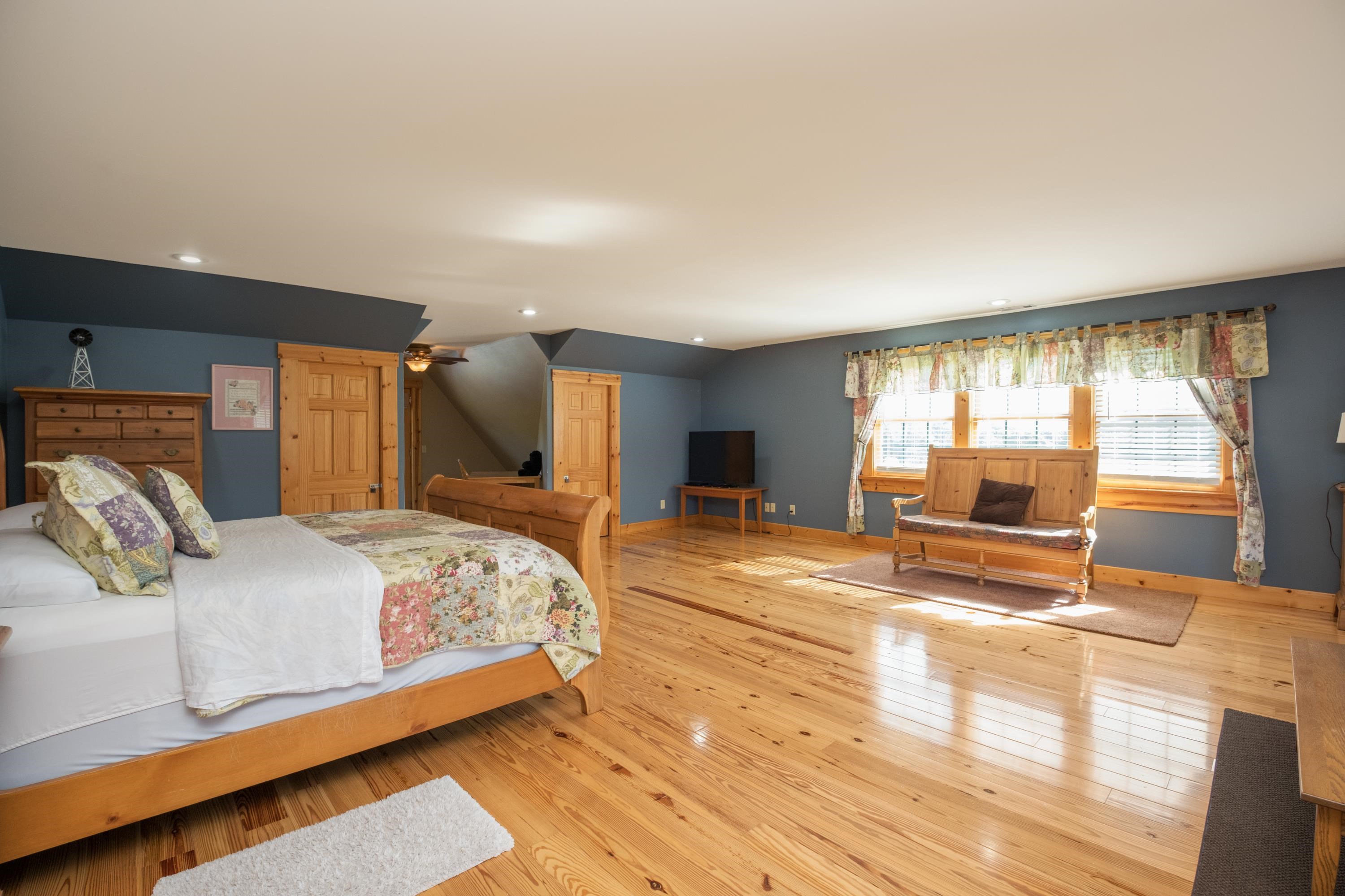 14238 Plains Mill Road Timberville, VA 22853 - Photo 33 of 68 a bedroom with a large bed and a large window