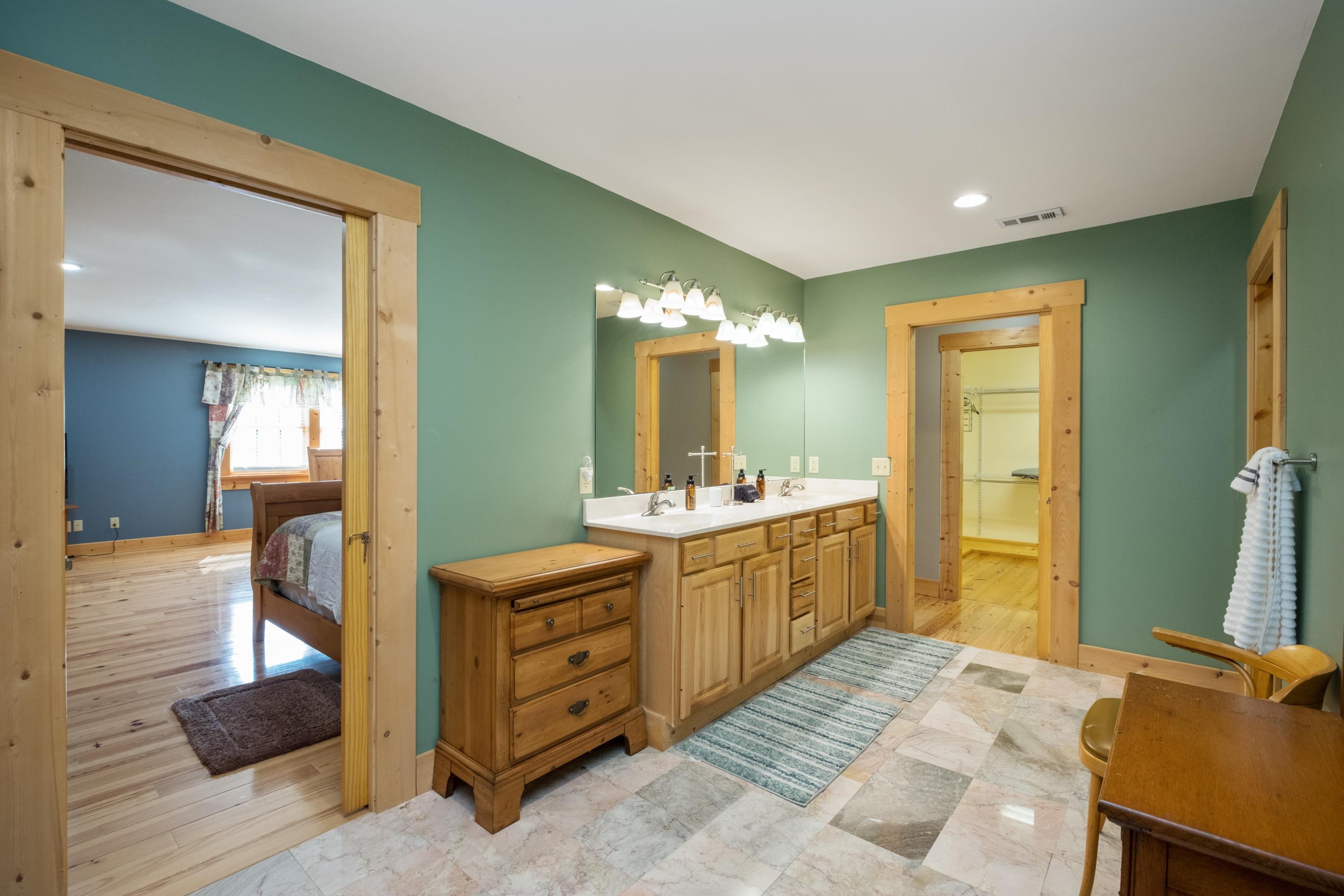 14238 Plains Mill Road Timberville, VA 22853 - Photo 35 of 68 a spacious bathroom with a double vanity sink and a mirror