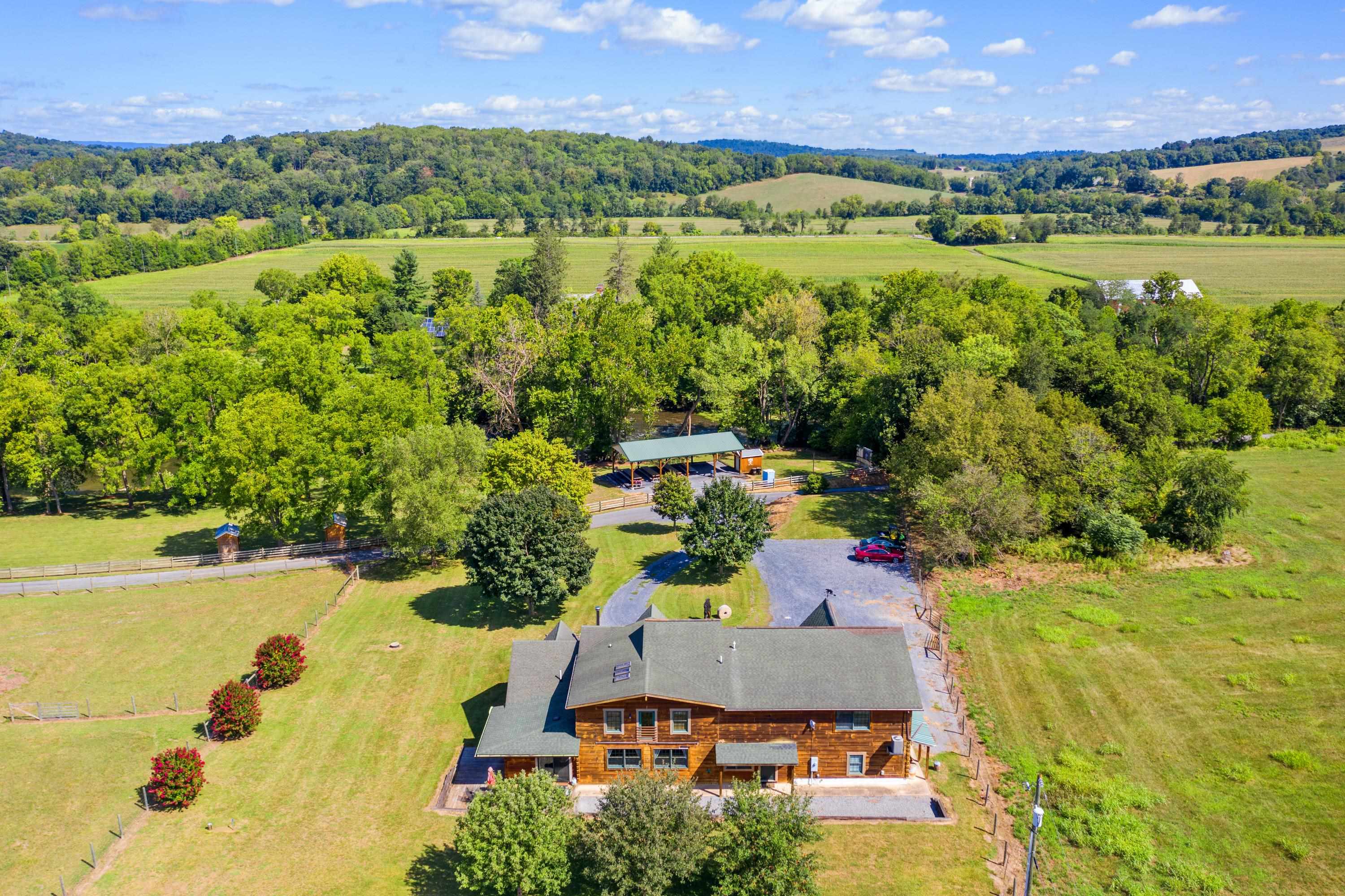 14238 Plains Mill Road Timberville, VA 22853 - Photo 4 of 68 an aerial view of residential houses with outdoor space and lake view