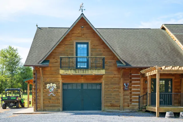 a view of a patio with table and chairs a barbeque with wooden fence and floor