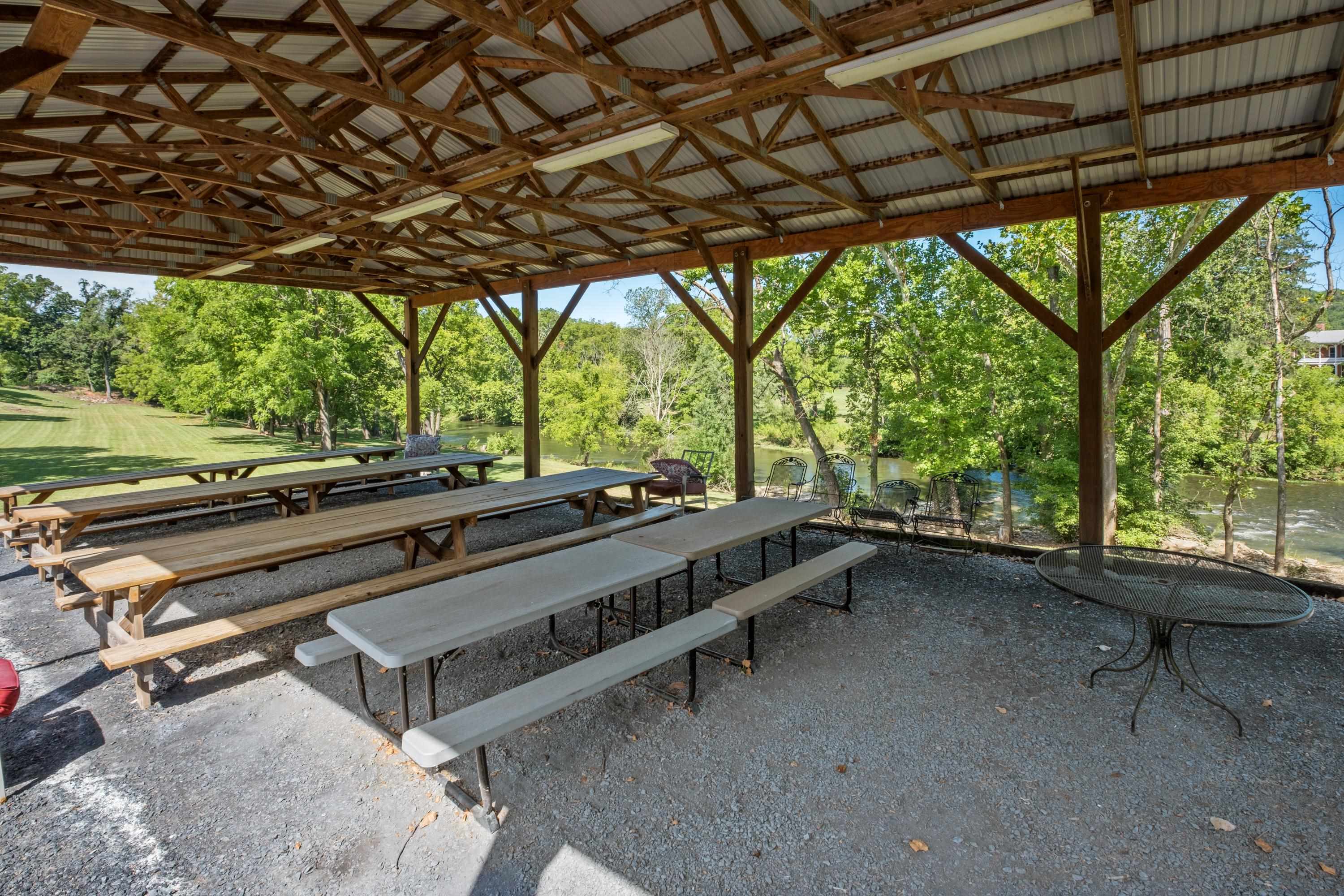 14238 Plains Mill Road Timberville, VA 22853 - Photo 67 of 68 a view of a patio with table and chairs a barbeque with wooden fence and floor