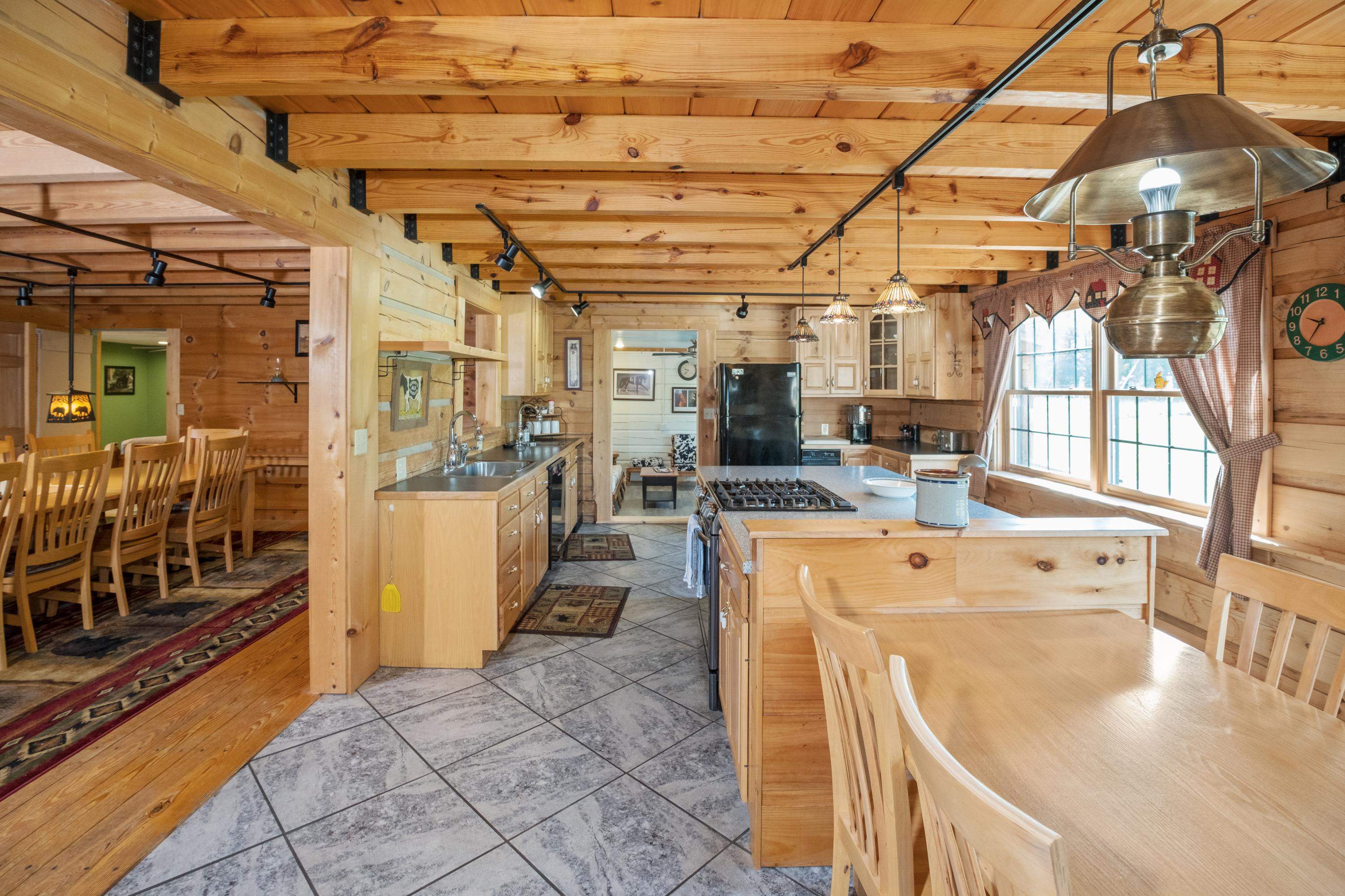 14238 Plains Mill Road Timberville, VA 22853 - Photo 10 of 68 a view of a kitchen with stainless steel appliances granite countertop a sink and wooden floors