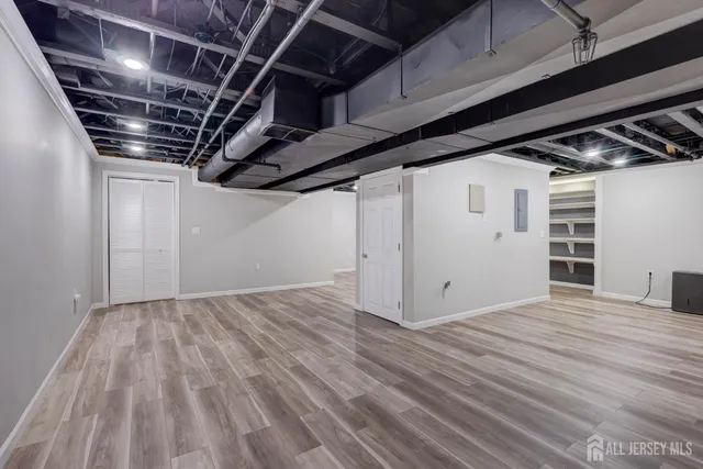 a view of a room with a ceiling fan and a chandelier fan