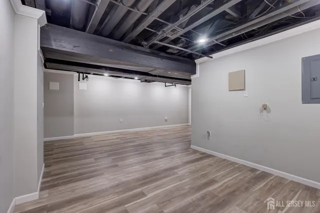 an empty room with a ceiling fan and bathroom