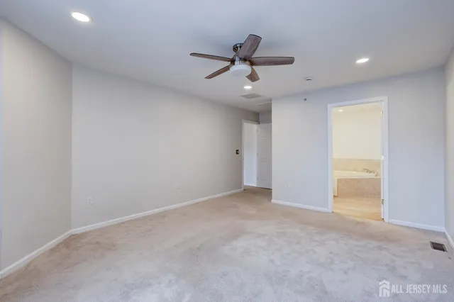 a front view of a residential houses with yard and trees